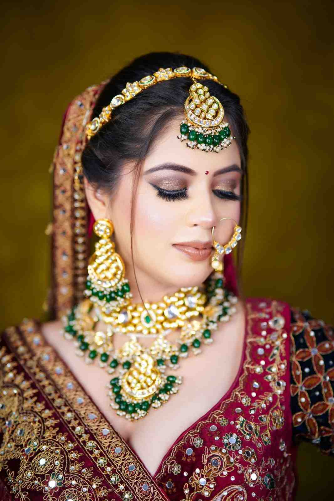 Traditional Red & Gold Bridal Makeup with Emerald Jewelry